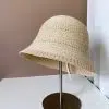 Chapeau de pêcheur en acrylique tricoté creux pour femmes, offrant une protection solaire